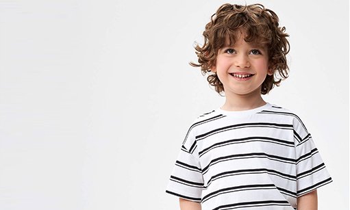 Boy in a black and white striped t-shirt